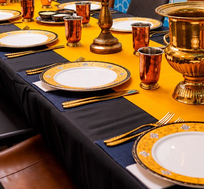 Gold-rimmed place settings at Urban Spices Balmain
